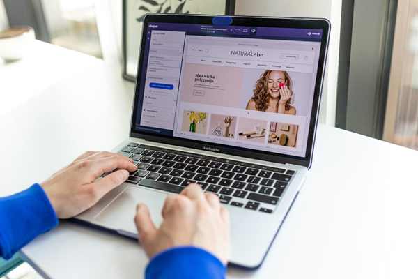 Tablet showing a website product page with a grid of product images and clear pricing.
