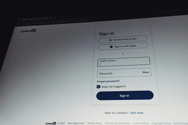 Desktop monitor displaying mobile app design mockups in a design tool.